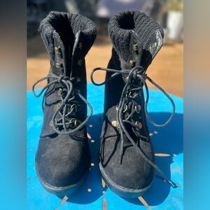 Black faux suede heeled combat boots.